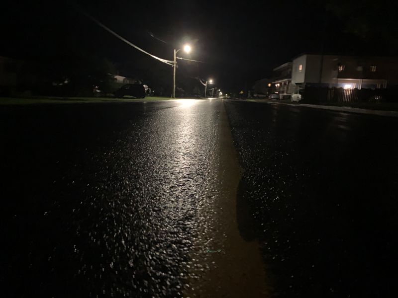 Rain-soaked street at night after a storm