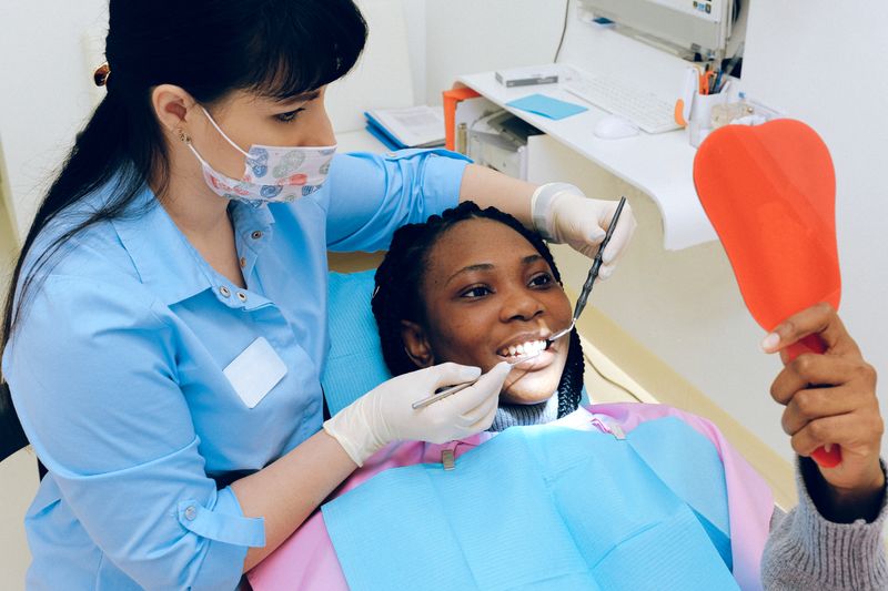 Dentist treating a patient in a modern clinic